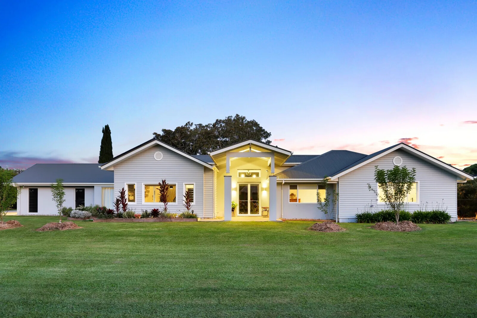 Completed Levcorp new home in Tallebudgera Valley at dusk