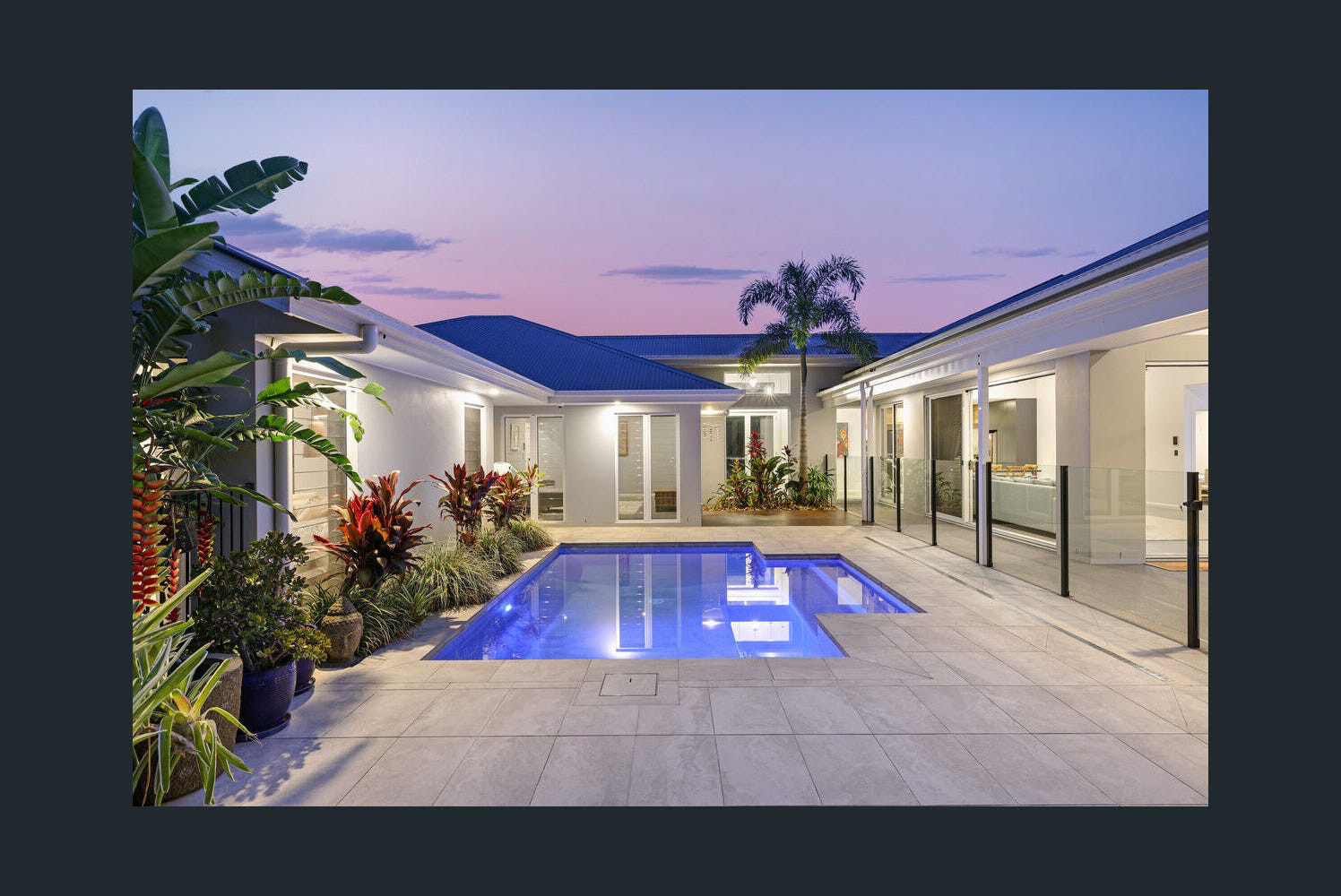 Pool and courtyard at twilight